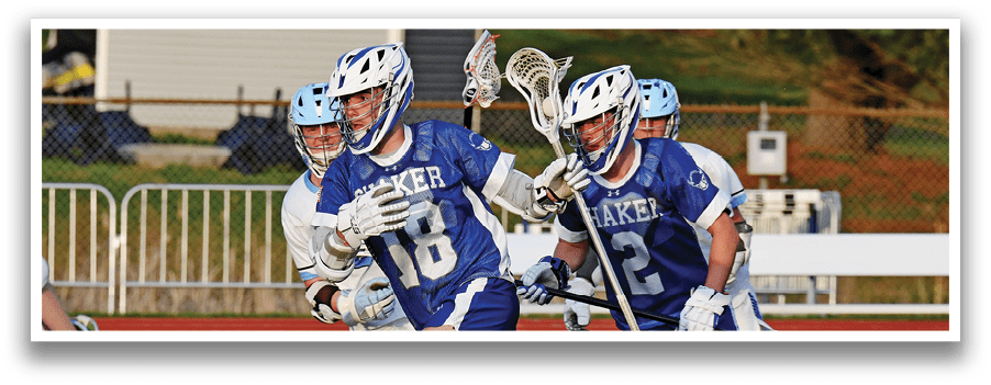 A group of lacrosse players running on a field. AI generated content