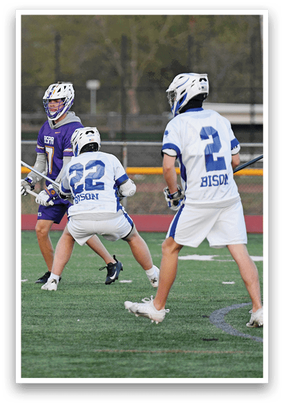 Three men playing lacrosse on a field. AI generated content