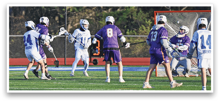 A group of young men playing a game of lacrosse on a field. AI generated content