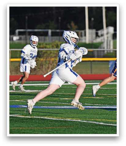 Three young men are playing a game of lacrosse on a field. One of the players is running with a lacrosse stick, while the other two are running behind him. AI generated content