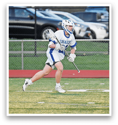 A man in a white and blue uniform is running on a field while holding a lacrosse stick. AI generated content