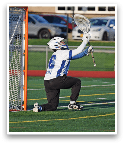 A man is kneeling in front of a net, holding a lacrosse stick. AI generated content
