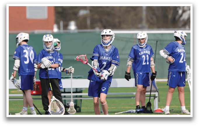 A group of young men wearing blue jerseys and helmets are standing on a field, holding baseball bats. AI generated content