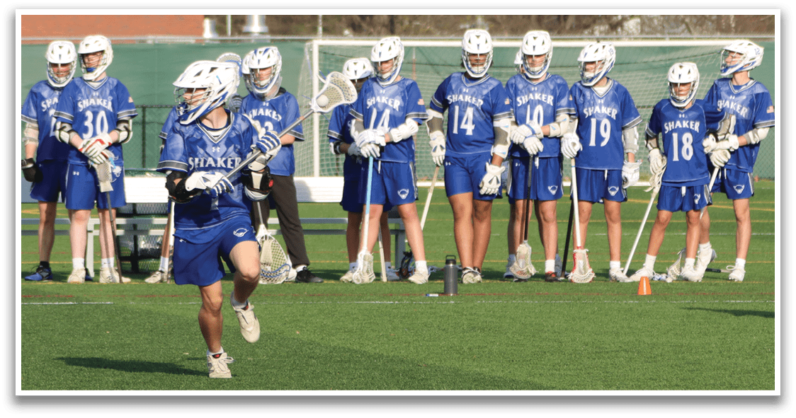 A group of people are playing a game of lacrosse on a field. AI generated content