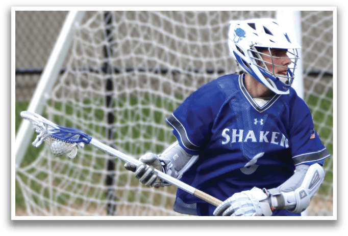 A man wearing a blue and white uniform is running with a lacrosse stick in his hand. AI generated content