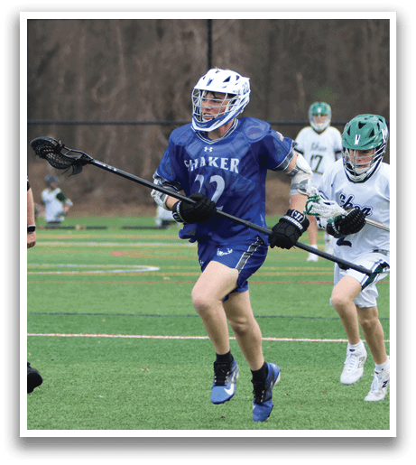 A group of people playing a game of lacrosse on a field. A man in a blue uniform is running with a lacrosse stick. AI generated content