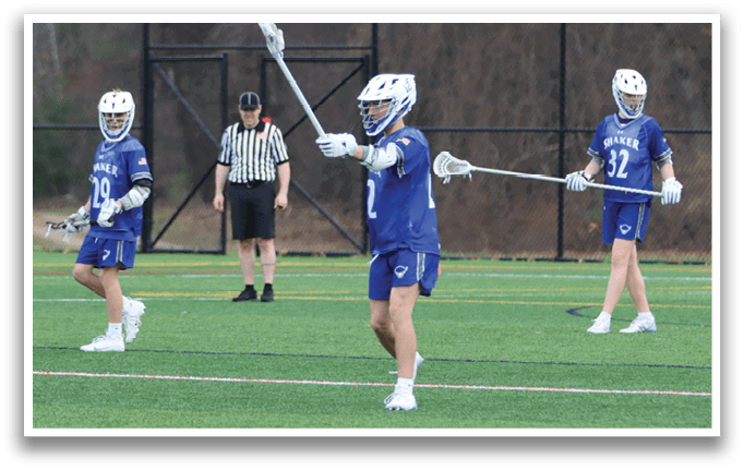 Three men playing lacrosse on a field. One of the players is holding a stick and pointing it up. AI generated content