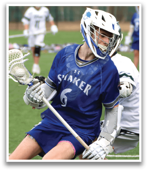 A man wearing a blue and white jersey is holding a lacrosse stick and getting ready to shoot the ball. AI generated content