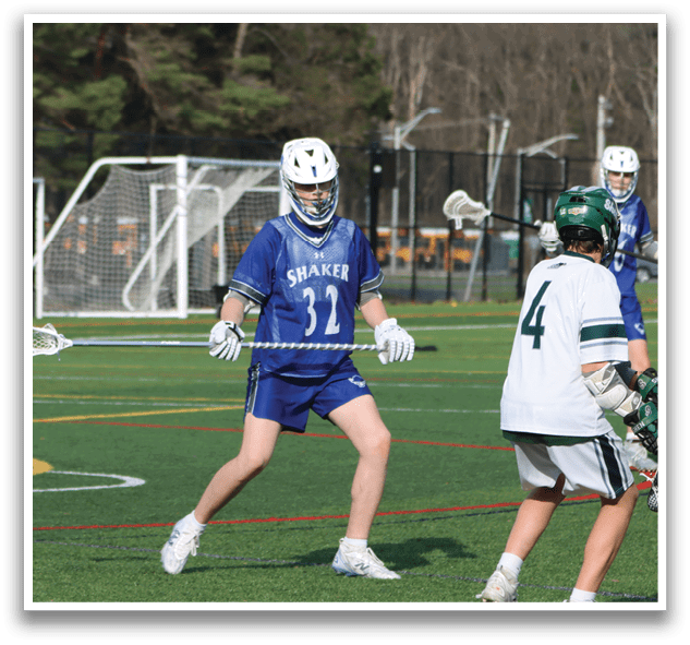 Two lacrosse players from opposing teams are running towards a ball on a field. AI generated content