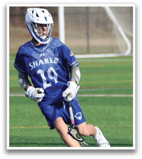 A man wearing a blue and white shirt and white socks is running on a field. AI generated content