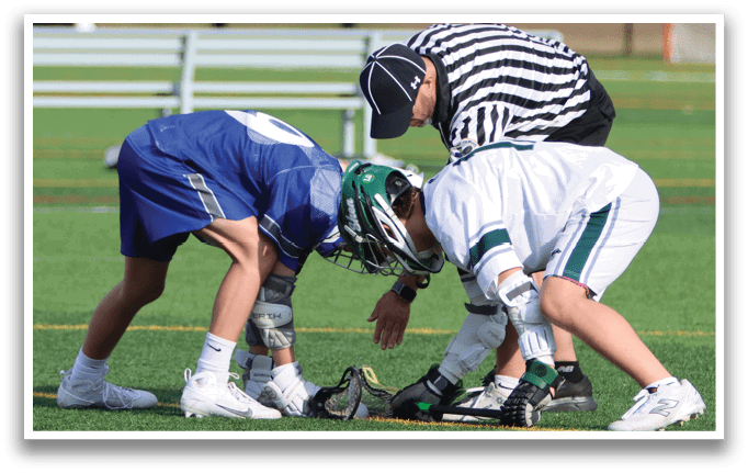 Two boys are playing a game of football on a field. One boy is holding the ball while the other two boys are trying to get the ball from him. The boys are wearing uniforms and one of them is wearing a green helmet. AI generated content