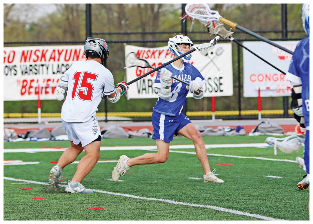 A group of people playing a game of lacrosse. Description generated by AI