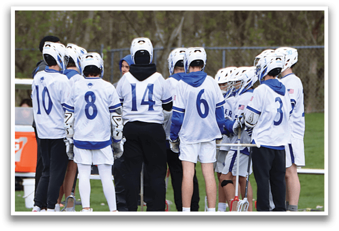 A group of people wearing white and blue uniforms. Description generated by AI