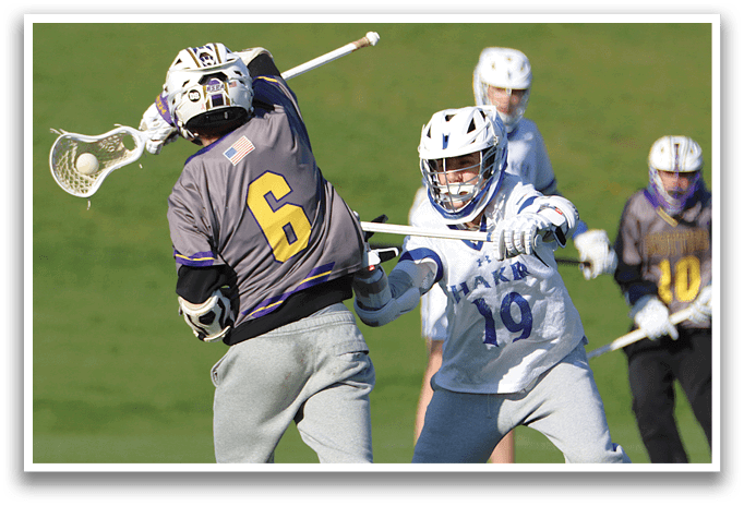 Two men playing lacrosse. Description generated by AI