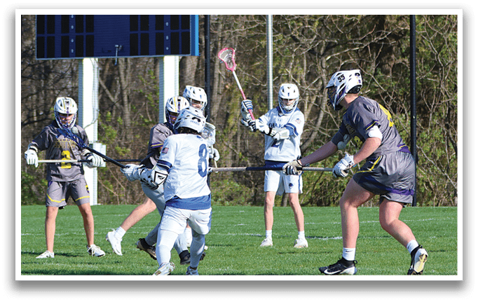 A group of people playing a game of lacrosse. Description generated by AI