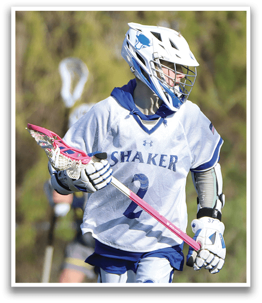 A person holding a pink and black lacrosse stick. Description generated by AI