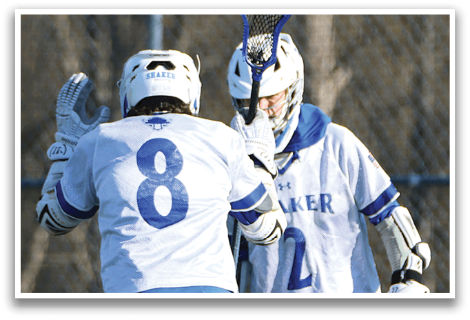 Two lacrosse players wearing number 8 and 2 shirts. Description generated by AI