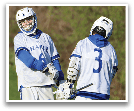 Two men wearing white and blue uniforms. Description generated by AI