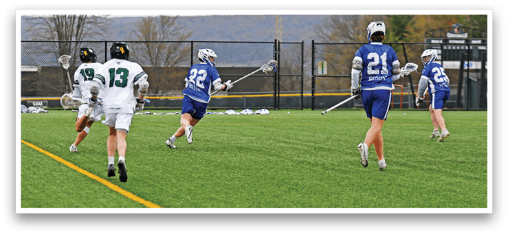 A group of people playing a game of lacrosse. Description generated by AI