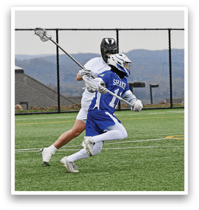 A man in a blue and white uniform is running on a field. Description generated by AI