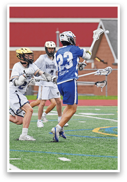 A group of people playing a game of lacrosse. Description generated by AI