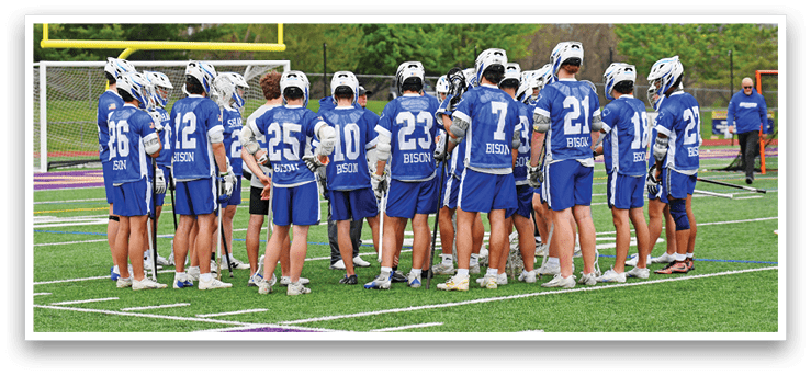 A group of people wearing blue and white uniforms. Description generated by AI