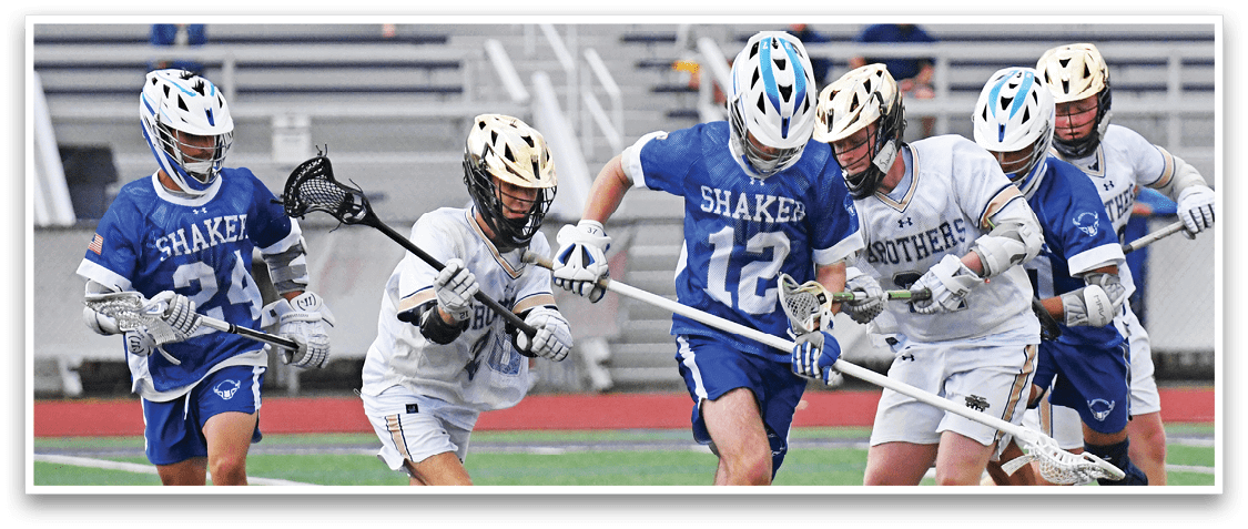 A group of people playing a game of lacrosse. Description generated by AI