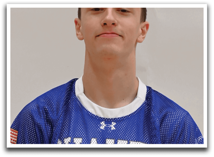 A young man wearing a blue and white shaker jersey. Description generated by AI