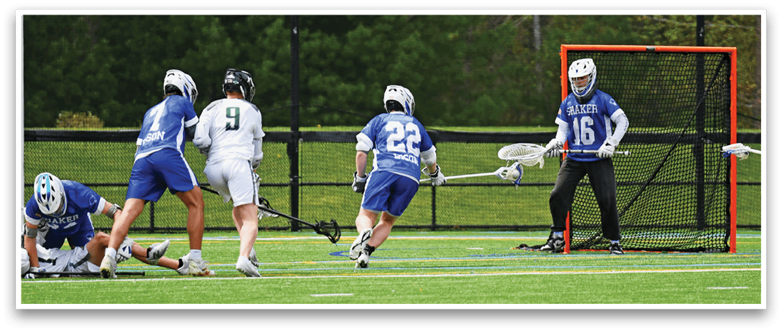 A group of people playing a game of lacrosse. Description generated by AI