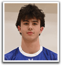 A young man wearing a blue and white jersey with the number 7 on it. Description generated by AI