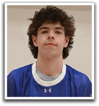 A young man wearing a blue and white jersey with the number 12 on it. Description generated by AI