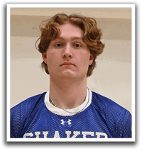 A young man wearing a blue and white jersey with the number 21 on the front. Description generated by AI