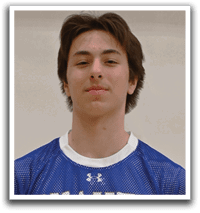 A man wearing a blue and white jersey with the number 26 on it. Description generated by AI