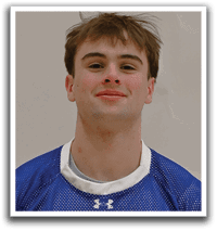 A young man wearing a blue and white shaker jersey. Description generated by AI