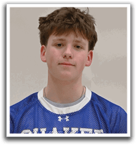 A young man wearing a blue and white shaker jersey. Description generated by AI