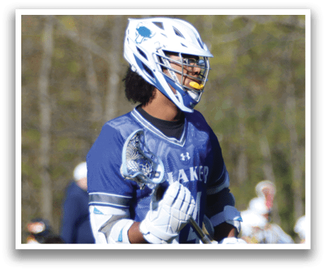 A man wearing a blue and white jersey with the number 44 on it. Description generated by AI