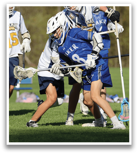 A group of people playing a game of lacrosse. Description generated by AI