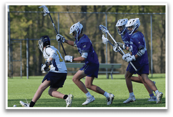 Three boys playing lacrosse on a field. Description generated by AI