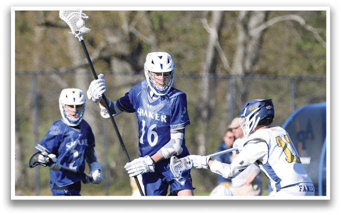 A group of young men playing lacrosse. Description generated by AI