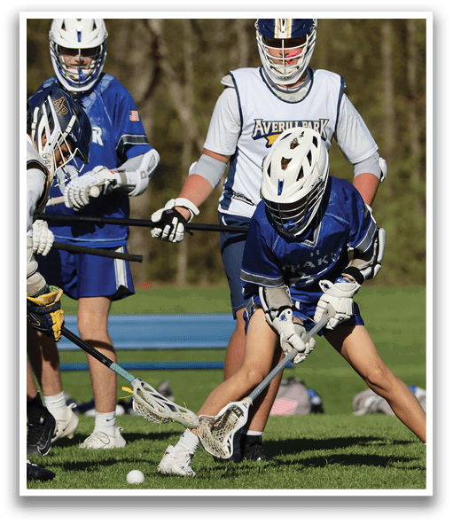 A group of people playing a game of lacrosse. Description generated by AI