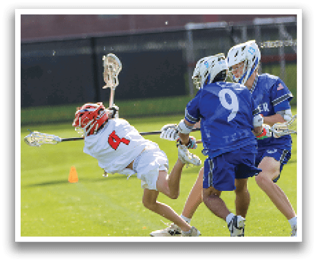 A group of men playing lacrosse. Description generated by AI