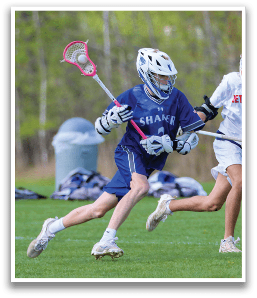 Two people playing lacrosse. Description generated by AI
