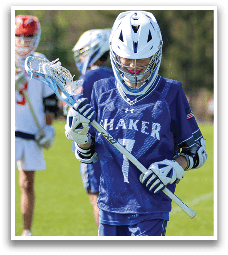 A young man wearing a blue shirt with the number 7 on it. Description generated by AI