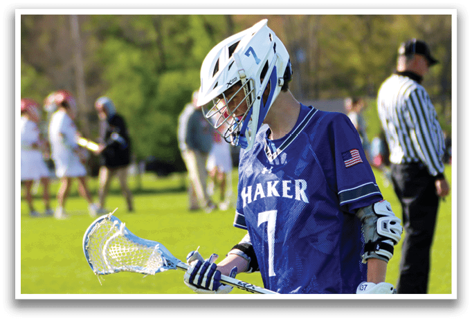 A young man wearing a blue and white jersey with the number 7 on it. Description generated by AI