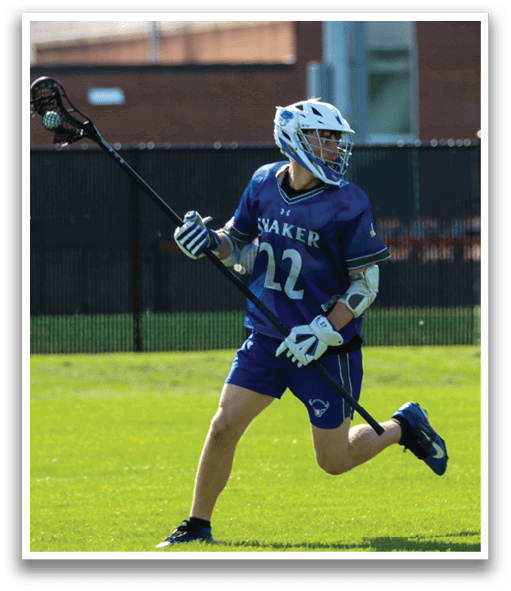 A man wearing a blue and white shirt and white gloves is holding a black and white lacrosse stick. Description generated by AI