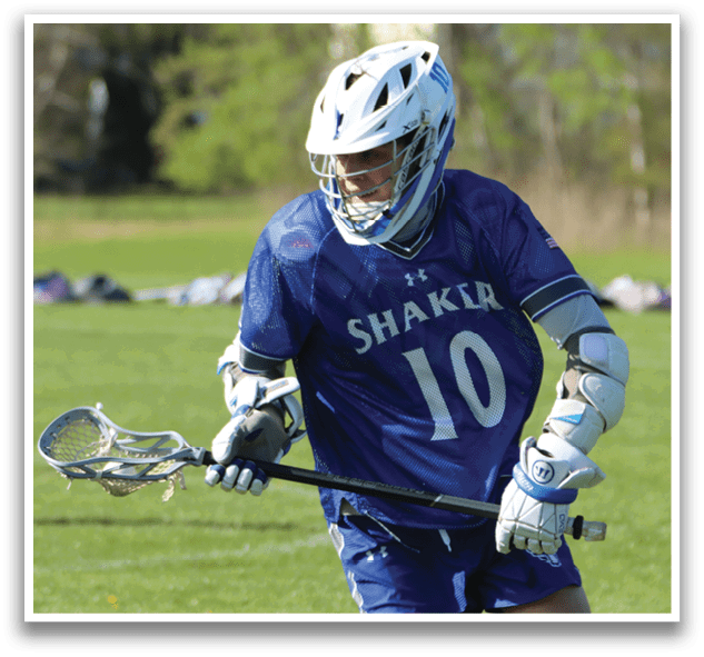 A boy wearing a blue and white shirt with the number 10 on it. Description generated by AI