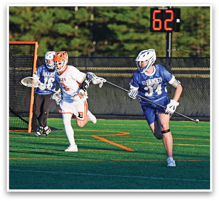 A man in a blue and white uniform is running on a field. Description generated by AI
