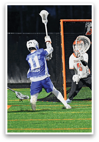 A group of people playing a game of lacrosse. Description generated by AI