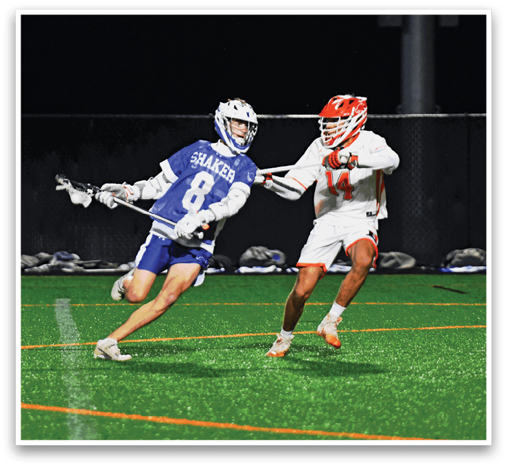 A man wearing a blue and white uniform is running on a field. Description generated by AI