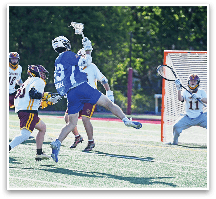 A group of people playing a game of lacrosse. Description generated by AI